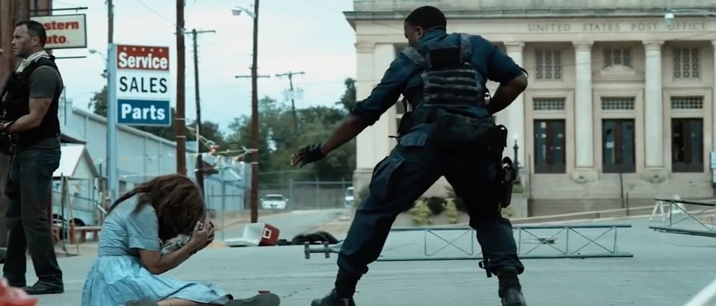 officer on street helping victim