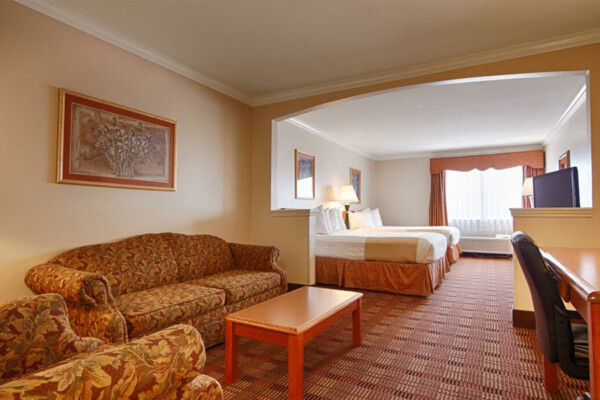 Interior of Best Western Club House Inn & Suites hotel room with beds and desk