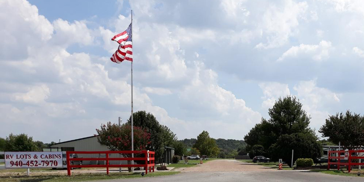 Country Living Retreat Entrances with flag poles
