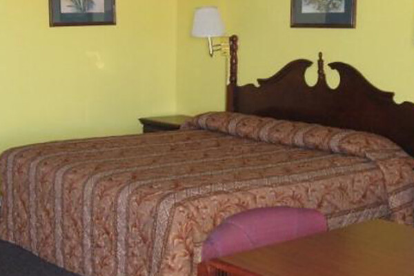 Executive Inn hotel room with bed