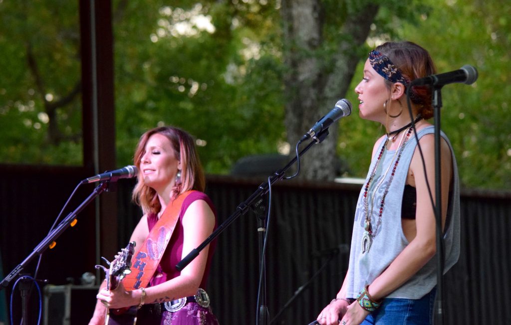 Female musicians on stage singing