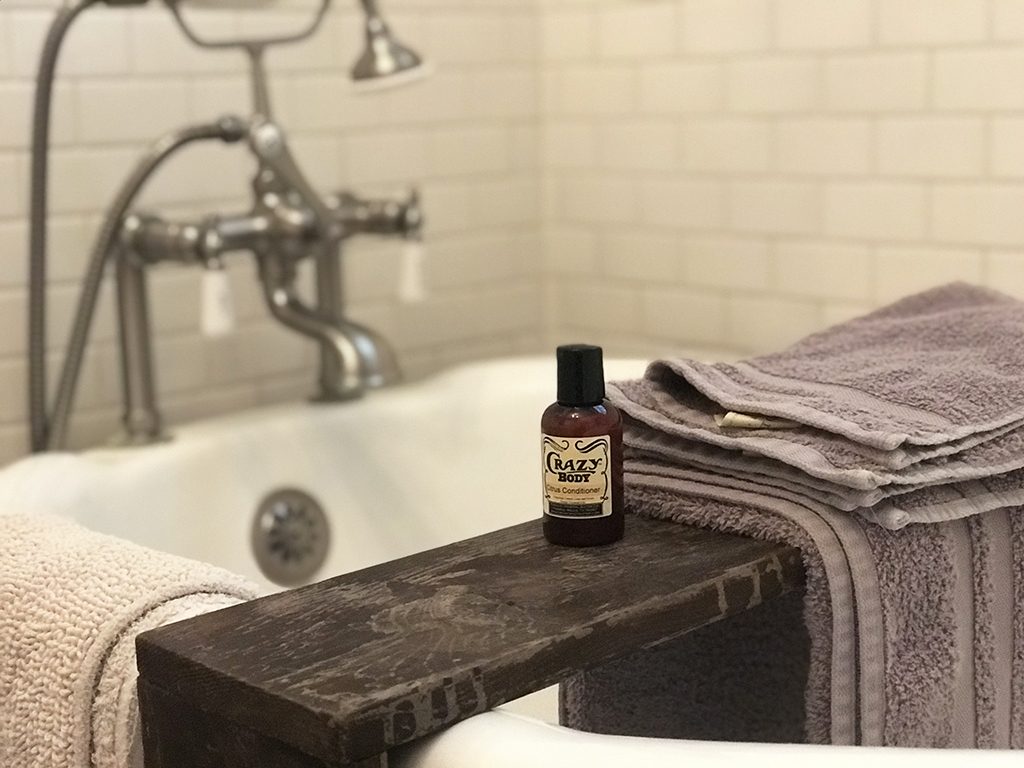 Towels and body wash in bathtub