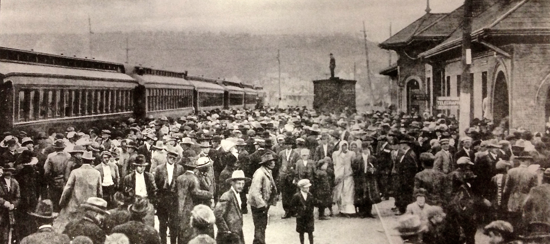 Passengers waiting to board train at The Weatherford, Mineral Wells & Northwestern Railroad circa 1900.