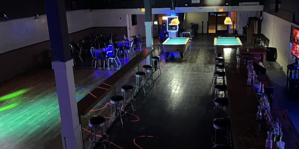 940 dance hall with chairs and pool tables.