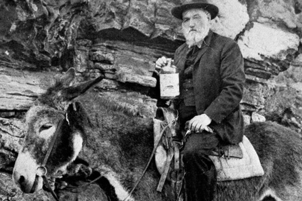 James-Alvis-Lynch on a mule holding bottle