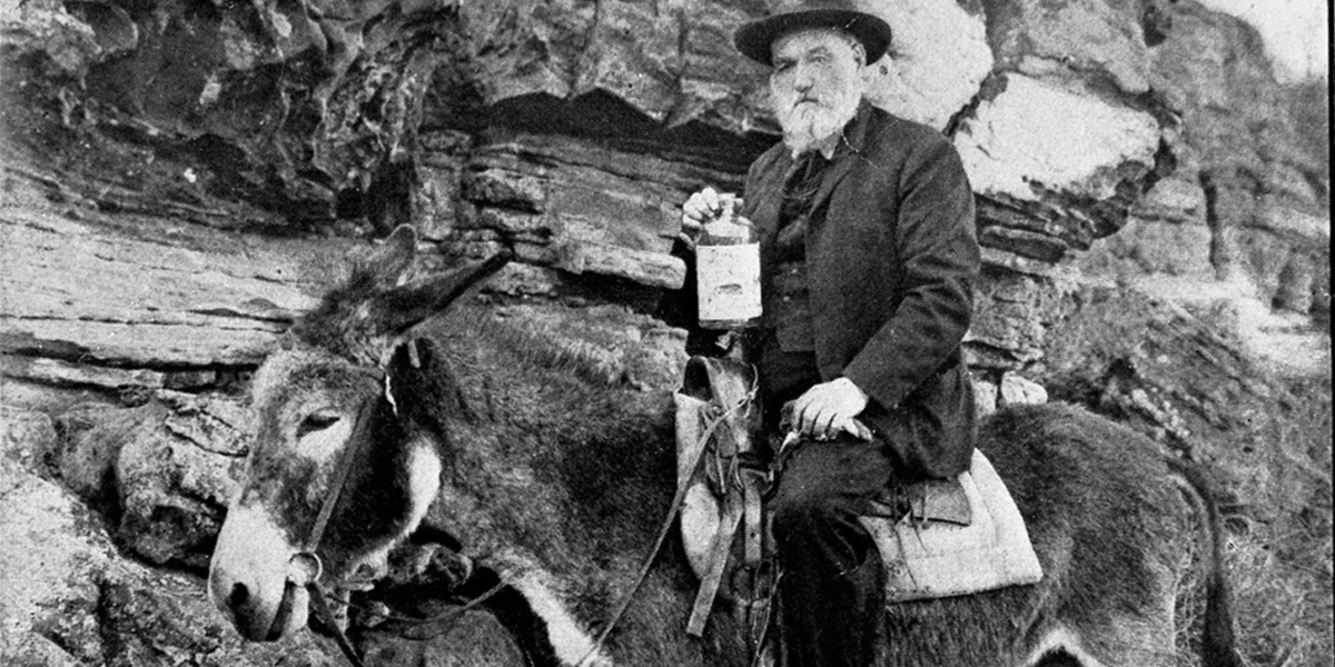 James-Alvis-Lynch on a mule holding bottle