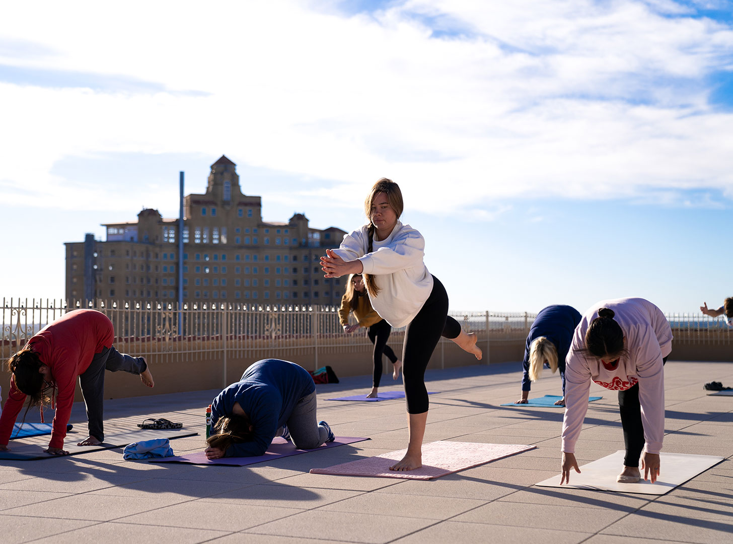 Women on rooftop doing yoga