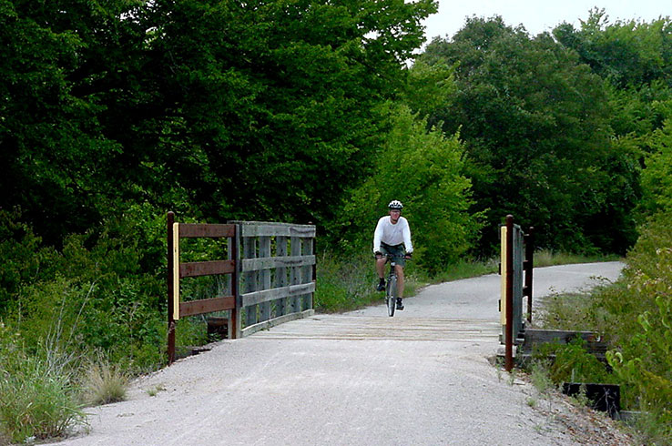 man riding bike on Lake Mineral Wells Trailway