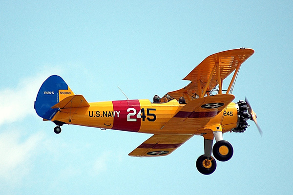 Vintage airplane in sky at Mineral Wells Fly-in