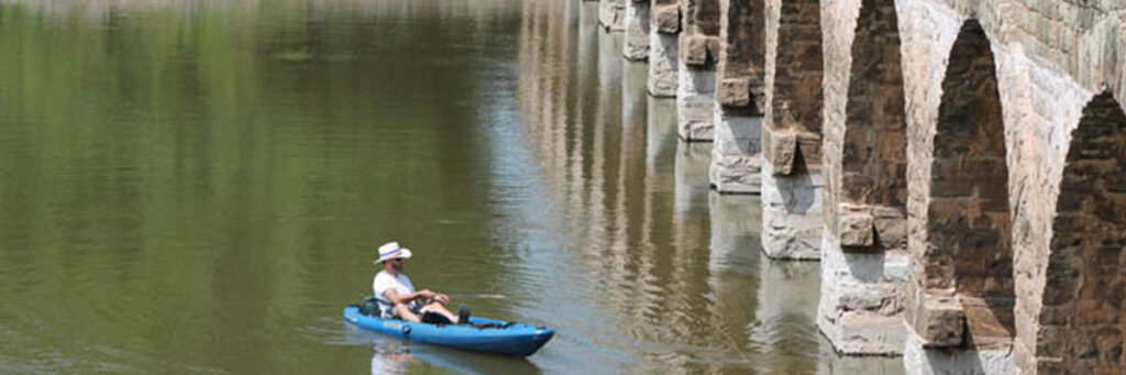Man in kayak fishing on The Brazos river