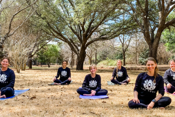 PAV Yoga classes in field under trees