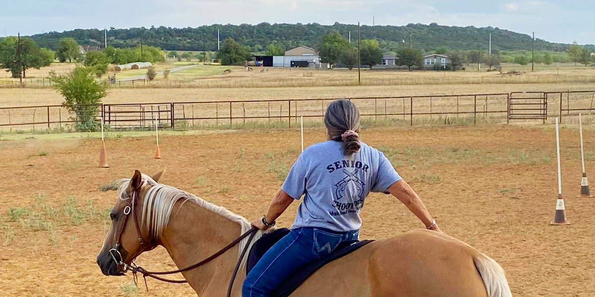 Rider on horse ar 2 Irons Ranch