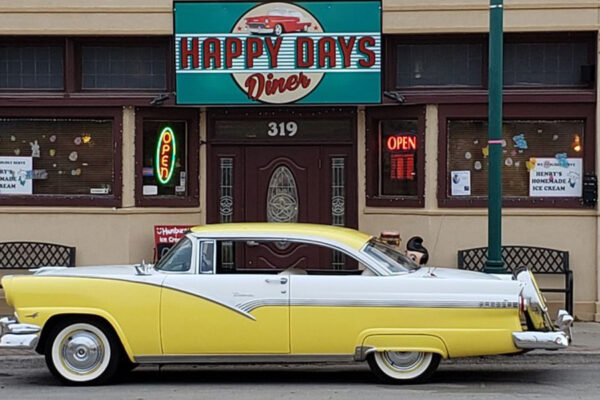 Happy Days Diner with vintage car parked in front